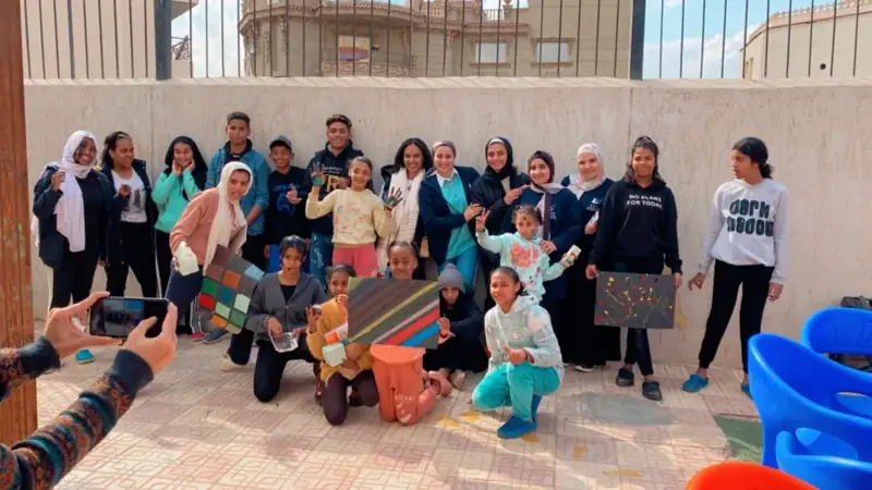 Group with their paintings at FACE for Children in Need